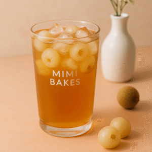 Ly trà nhãn mát lạnh với đá và trái nhãn, thương hiệu Mimi Bakes