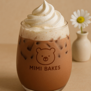 Ly cacao latte với đá viên và kem tươi, logo Mimi Bakes, nền pastel nâu kem