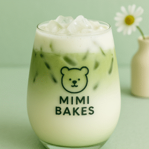 Ly matcha sữa dừa với đá viên, màu xanh và trắng hòa quyện, logo Mimi Bakes, nền xanh pastel